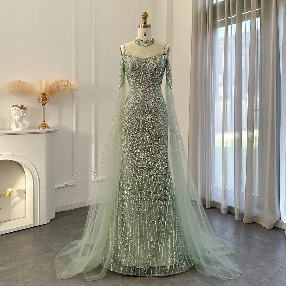 Beaded sage green evening gown with sheer cape sleeves